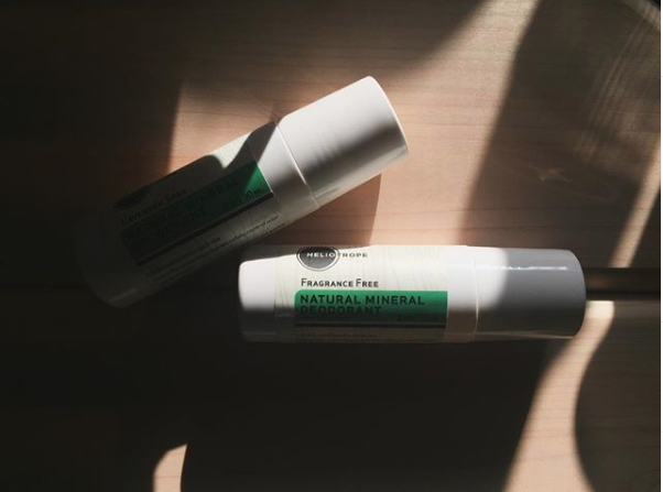 Natural mineral deodorant roll-on bottle in soft natural lighting