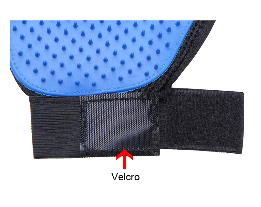 Close-up of the blue pet grooming glove and adjustable Velcro strap
